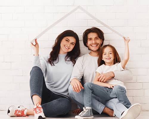 Happy family sitting in their new house floor in florida